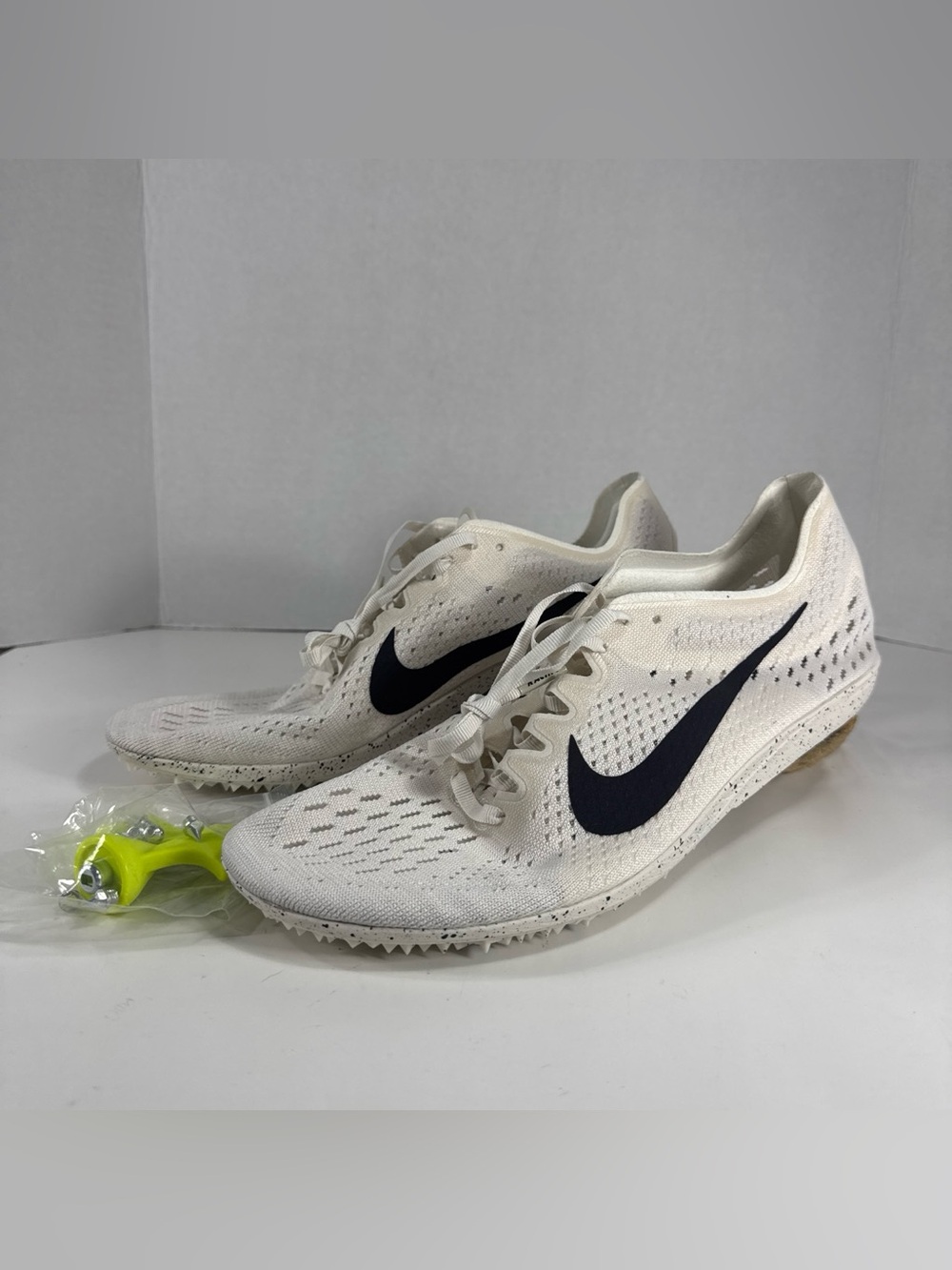 Nike Men’s White Running Spikes with Black Swoosh